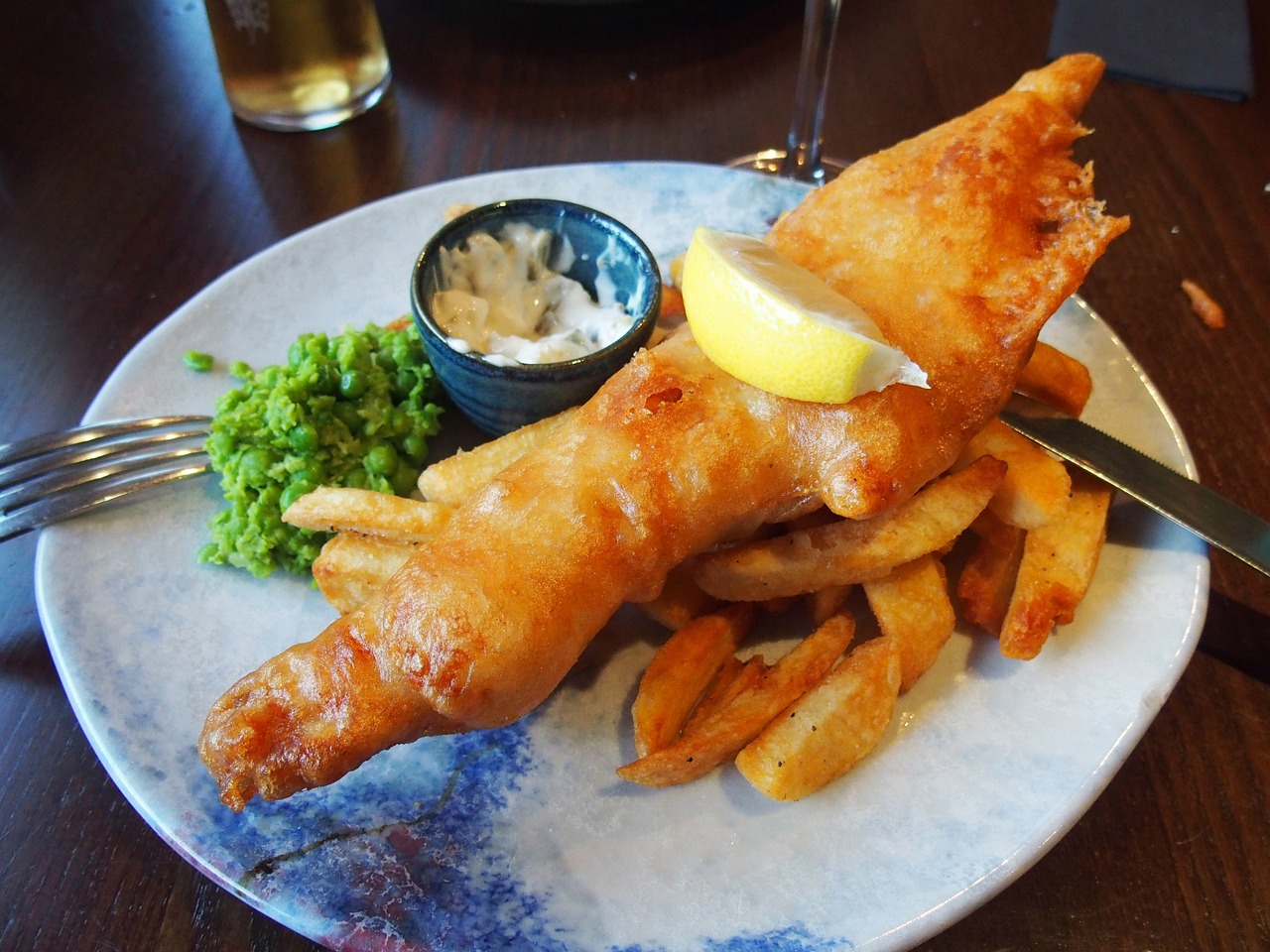 Craving that classic pub fare at home? This homemade beer-battered cod fish and chips recipe will hit the spot! Bring that beloved British cuisine right into your kitchen. Not only is it a wallet-friendly option when cod's on sale, but it also allows for a bit of culinary creativity. Using just a can of beer, some flour, and potatoes, you can whip up this dish with ease. I shares my Massachusetts-inspired take on this classic recipe. Great for your omega-3s!
