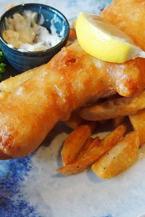 Craving that classic pub fare at home? This homemade beer-battered cod fish and chips recipe will hit the spot! Bring that beloved British cuisine right into your kitchen. Not only is it a wallet-friendly option when cod's on sale, but it also allows for a bit of culinary creativity. Using just a can of beer, some flour, and potatoes, you can whip up this dish with ease. I shares my Massachusetts-inspired take on this classic recipe. Great for your omega-3s!