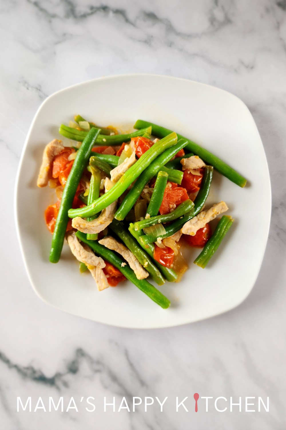 Today, I'm super excited to share another yummy Filipino recipe, Ginisang Baguio Beans, which is a simple dish made with fresh green beans, tomatoes, and pork. This dish is super delicious and great for anyone who wants a quick Filipino meal. Many recipes use ground pork. I used thinly sliced pork cutlets instead. If you want, you can substitute almost any kind of meat, including ground pork or ground beef. You can either eat it as a full meal over rice, or as a side dish.