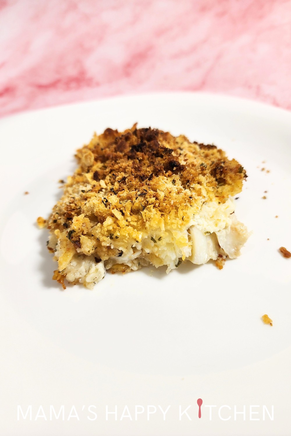 This Healthy New England Baked Scrod with Saltines recipe is perfect for those evenings when you want something special without spending hours in the kitchen. I use an old-school saltine cracker crust, but you can use any kind of topping: oyster crackers, Ritz, or, hold your hats, Cheerios. Yes, Cheerios! It sounds wild, but it works. A quick mix, a spread, a sprinkle, and into the oven it goes. Before you know it, you're pulling out a bubbling, aromatic dish that's sure to impress.