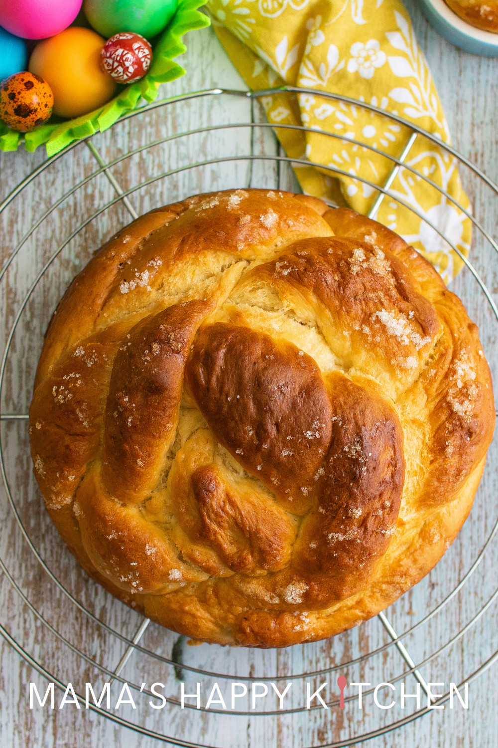 I'm slowly making my way to a complete Easter meal! And today, I have this easy sweet Easter bread recipe to serve at your dinner table. I realize that I just did a hot cross buns recipe, but this bread is for my centerpiece surrounded by colorful dyed eggs. I love the braided texture, and I think traditionally, you put some of those colorful eggs inside the braids, too. You can just use those chocolate eggs wrapped in pastel foil for a no-fuss decoration. Mine will be served on a cake platter.
