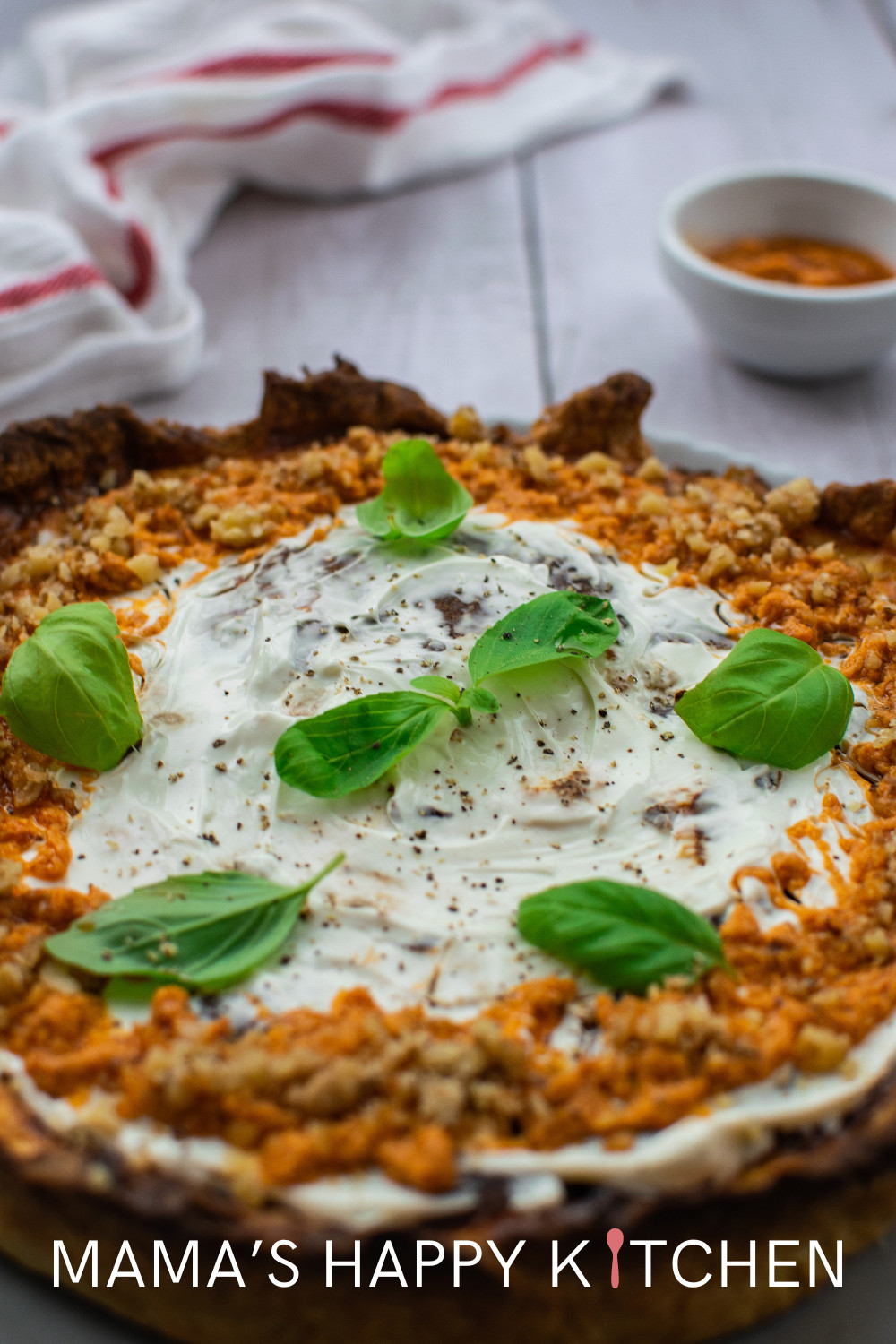 I created this recipe for a cheesecake without a graham cracker crust because I prefer not to use the graham crust. The store-bought variety is designed for pies and cannot contain all the cheesecake filling. Instead, I opted for a straightforward flour base, which provided a more traditional texture and was easier for me to prepare. The flour crust also ensures a sturdy foundation for the dense cheesecake layer, preventing any leaks or collapses. You can prebake the crust for a crispier edge.