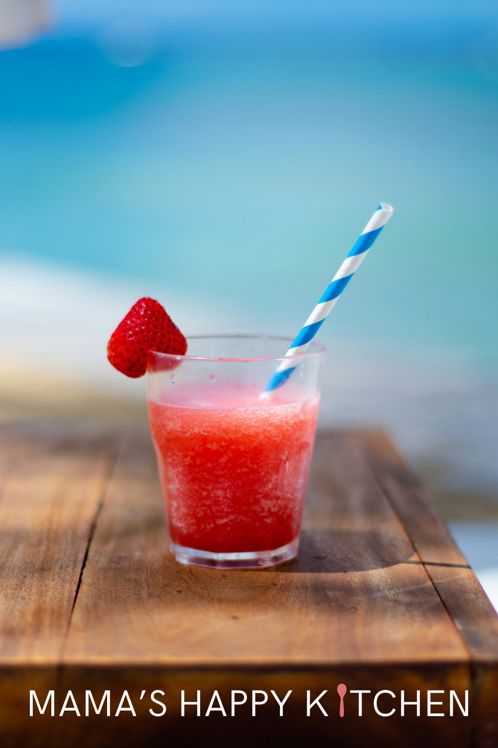 This frozen strawberry daiquiri recipe with vodka has got to be one of my most popular drinks. I serve it at almost every party, and people line up for it. The NutriBullet is going at a constant whirl! The secret to make this drink not watery is to use frozen strawberries. You can either them in the bag at the grocery store, or if you want some extra delicious flavor, go strawberry picking, slice off the tops, and throw them into the freezer for your party ... or just because you feel like one.