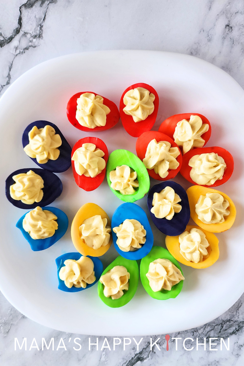 Today I am going to show you how to make colored deviled eggs for Easter. These eggs came out absolutely gorgeous! They are also really easy to make. If you don't want to use my deviled egg recipe, you can substitute your own. The secret is in how much food coloring to use for each egg set. But don't worry, I have the exact drop measurements you need to make a rainbow of Easter egg colors. I gave my eggs bold colors (instead of a more pastel palette) because I wanted them to pop on the plate.