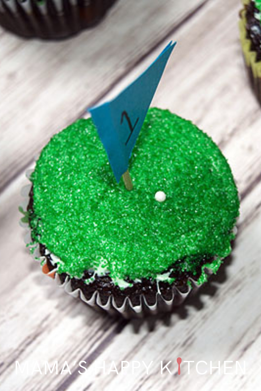 Happy Father’s Day! Today, I’m excited to share a special way to celebrate: with homemade golf-themed cupcakes. This recipe starts with a simple boxed mix for convenience. The top is green with a little flag, a small golf ball, and a little putting green ... so the dad in your life can spend the day golfing, even if he isn't on the fairway. These cupcakes, with their playful golf-inspired design, are perfect for the father (or mother!) in your life who loves the game.