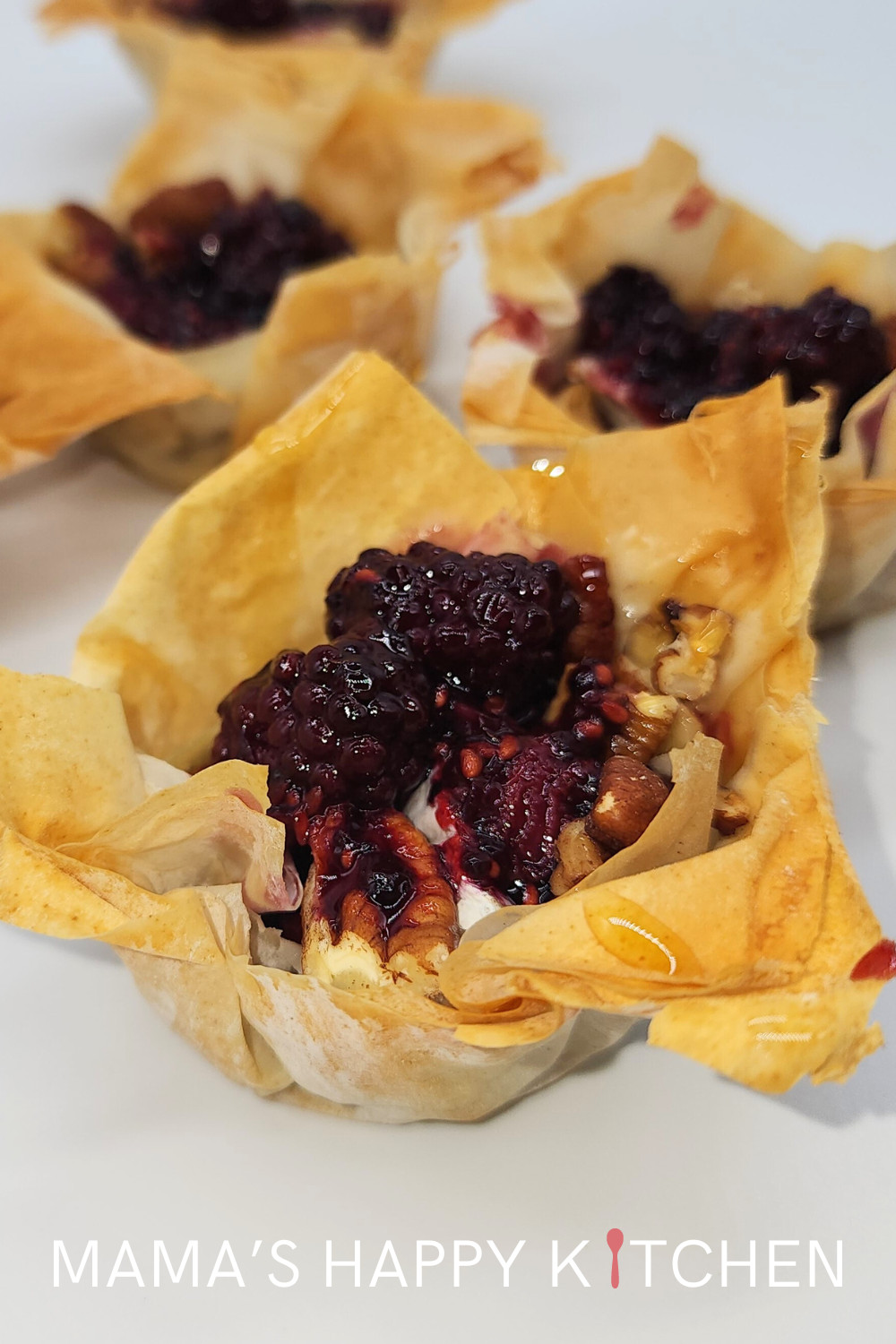 These phyllo brie bites are for my friend, who married a very bad guy. Okay, so I have a lot of friends who married bad guys. But this dude is very bad. We're fairly positive that he targeted and then conned her solely because she made more money than him. The worst part is that their child is stuck with an equally bad court system, which favors joint custody even over what really best for the child. My inspiration for them was Halle Berry, who recently had a victory in child support court!