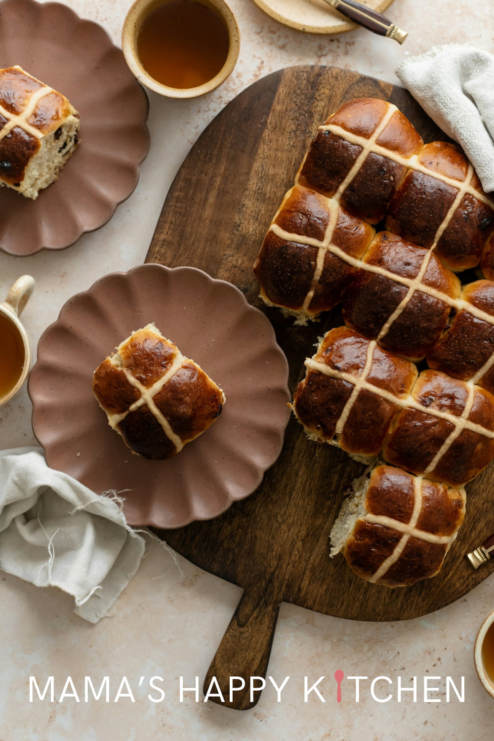 This traditional hot cross buns recipe makes a good base for tons of variations. You can add almost anything to make it your own: raisins or other fruits, different nuts, another icing, or sugar or jam instead of the butter glaze. One of my favorites is to add some chocolate chips. I also love making them more savory with a mixture of cottage and cream cheese in the middle. I think the only thing the remains the same is the X (cross) marking on the top, which represents the cross of Jesus.