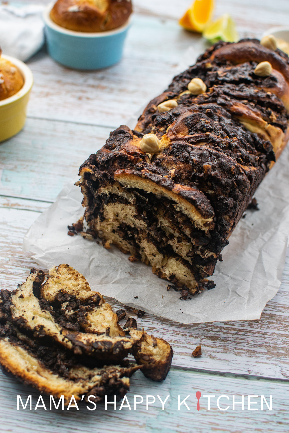 This easy chocolate babka bread recipe features a filling mixture with cocoa, hazelnuts, and rum. It's a sweet bread that you can serve as a dessert. Babka is sometimes called the King of the Jewish breads, and for good reason. The sweet indulgence is a great recipe for celebrating the end of Passover. You can bake my version either in the oven or the bread machine. Its rise (haha! get it!) in popularity marks its transition from a holiday exclusive to year-round in bakeries worldwide.