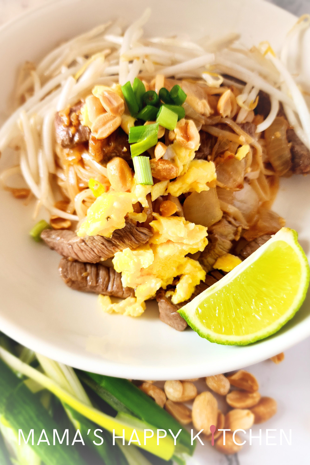This beef Pad Thai recipe features thinly sliced pieces of cooked beef, rice noodles, and my special Pad Thai sauce without tamarind. It's very similar to my chicken and shrimp Pad Thai, but made for beef lovers. Although beef can be expensive, this recipe has just one pound of it, so it goes a long way. Fresh vegetables like bean sprouts, carrots, and green onions add crunch and color, making the dish both visually appealing and nutritionally balanced, but also to help counteract the salt.